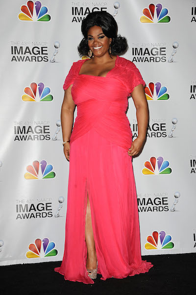 Jill Scott poses in costume in the press room at the 43rd annual NAACP Image Awards