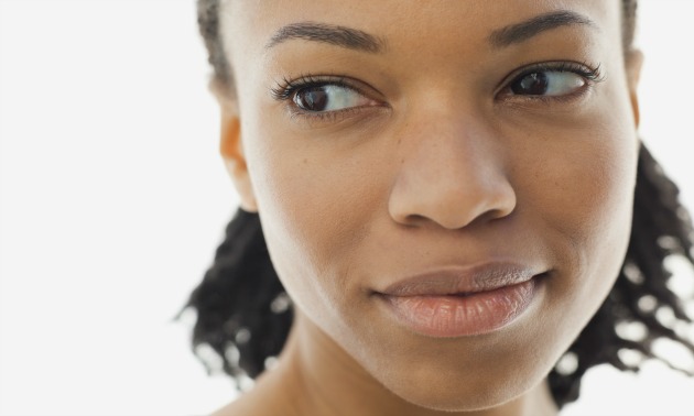 A close-up of a woman looking away