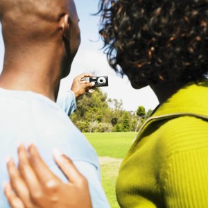 African couple taking own photograph