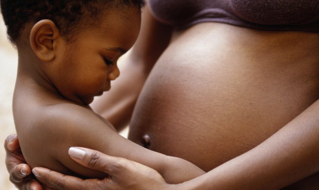 black pregnant woman with baby