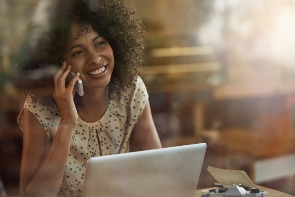 Black woman on phone & computer