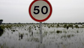 A road sign pokes out of the water 23 Se