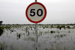 A road sign pokes out of the water 23 Se