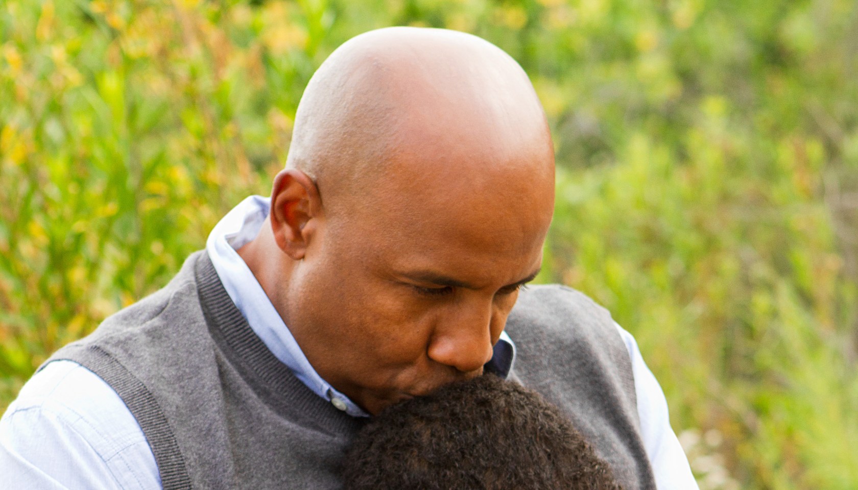 Father comforting his son