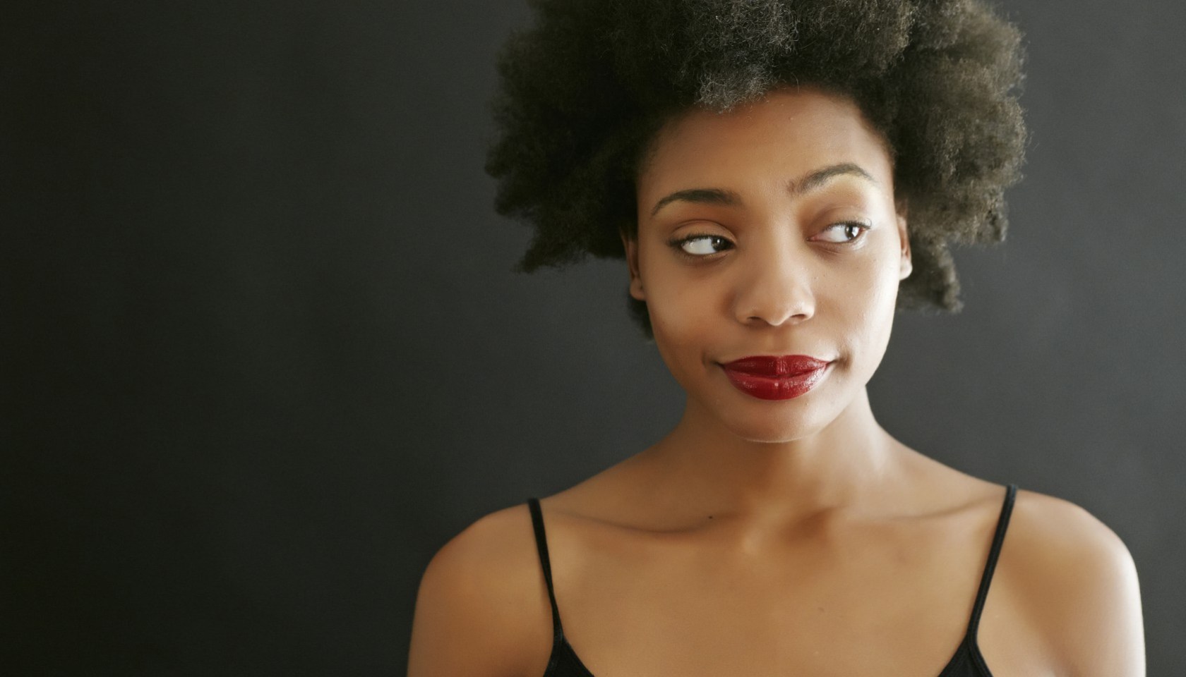 Close up of black woman smirking