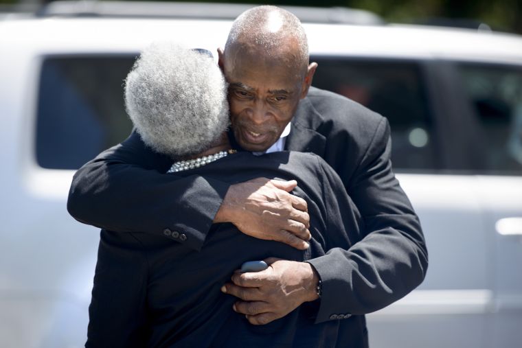 Mourning Church Members Embrace