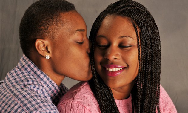 African American Lesbian Couple Kiss on Cheek