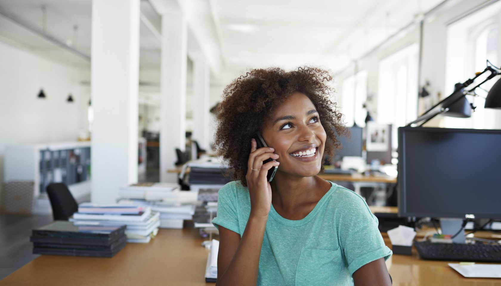 Portrait of girl laughing in creative office