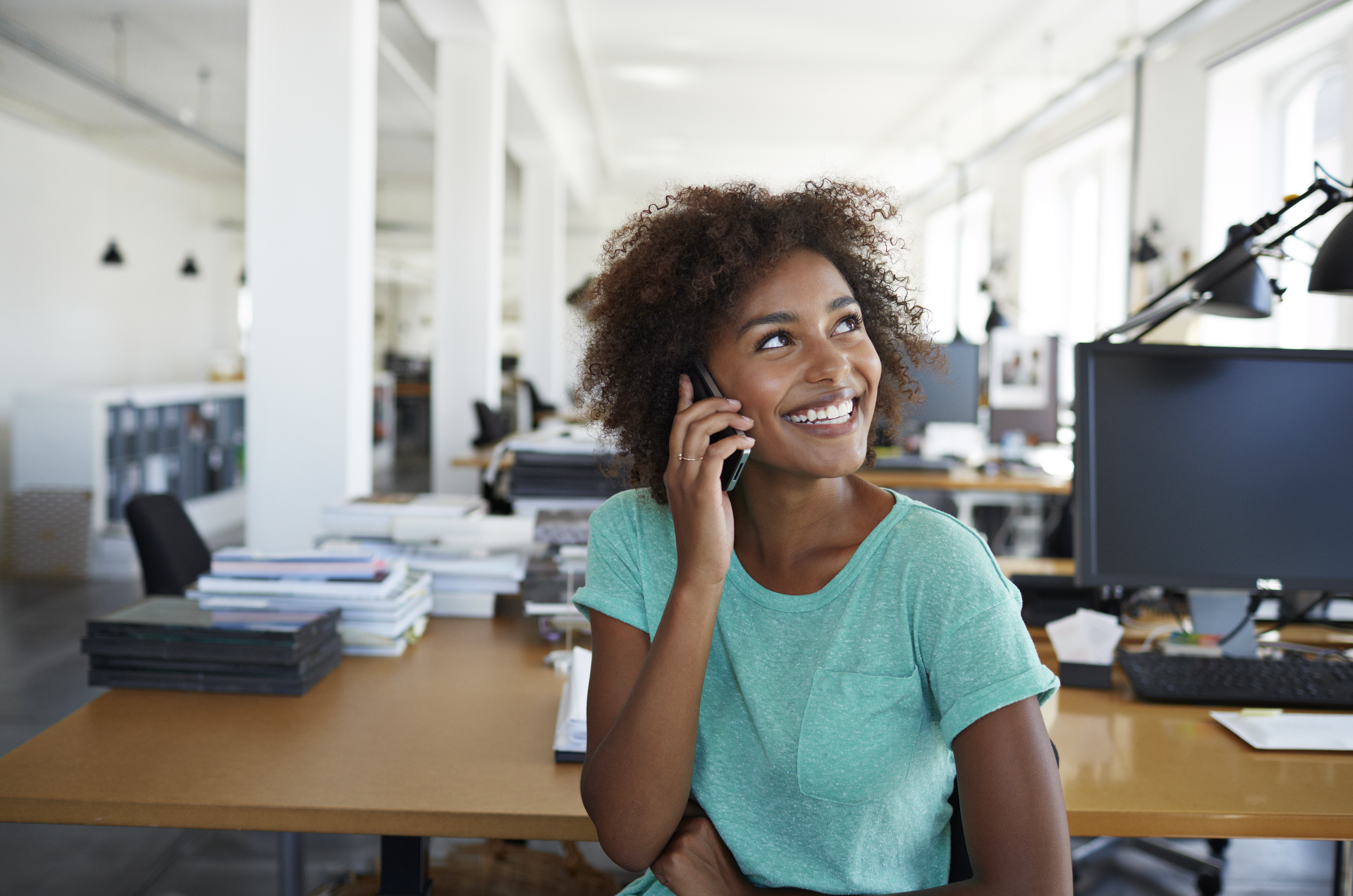 Portrait of girl laughing in creative office