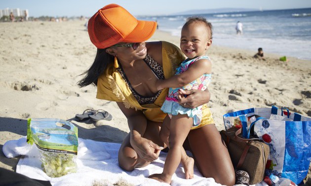 Mother and daughter playing on beach