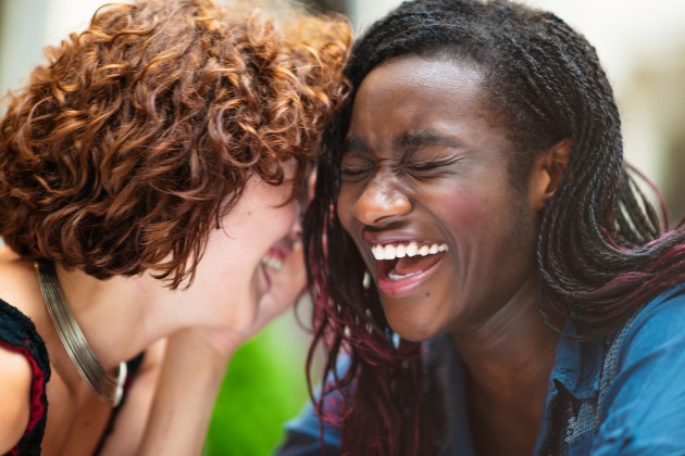 Laughing mixed race girlfriends