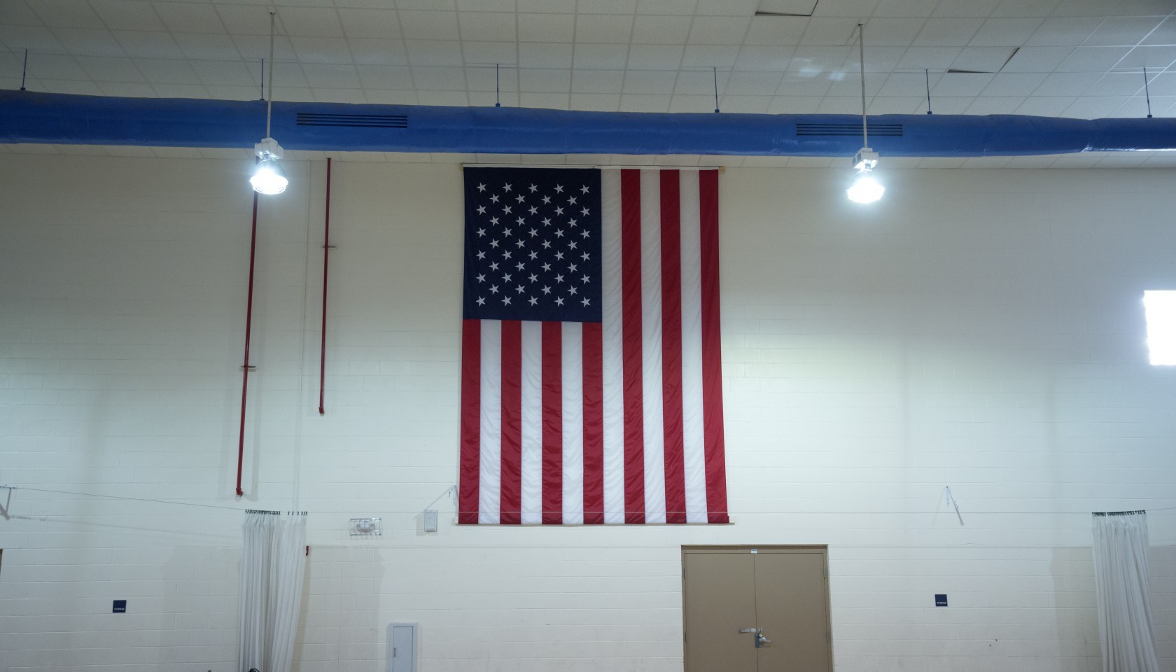 American flag in a school gym