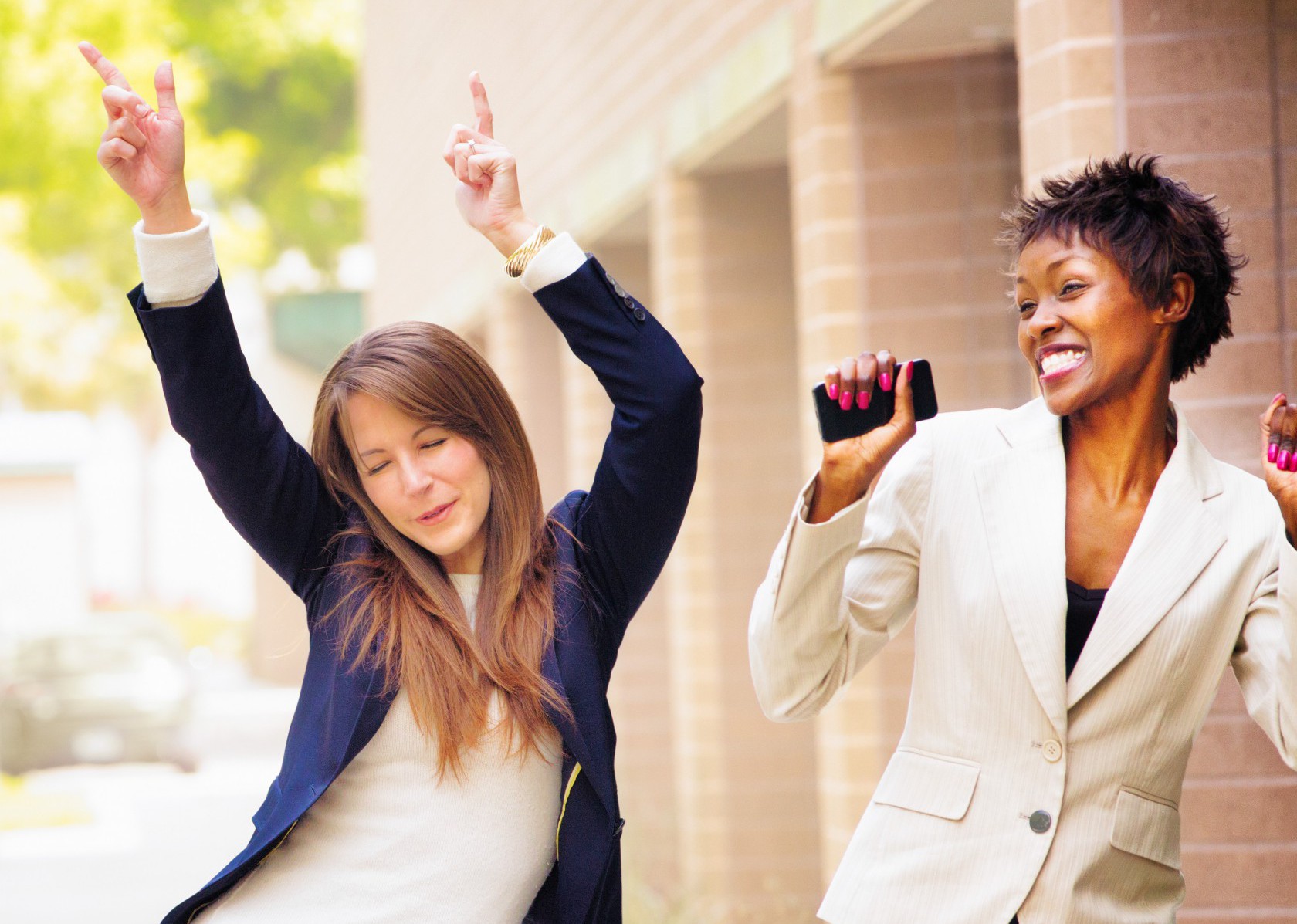 Office worker team does victory dance after receiving good news