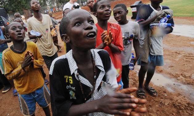 Ghanian boys ask for gifts as the bus tr