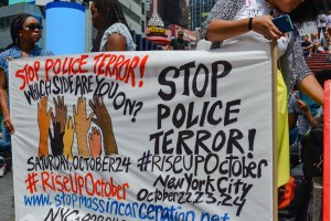 Demonstrators at the rally hold a banner advertising the...