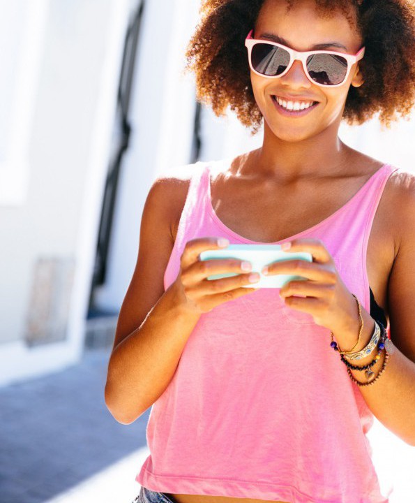 Girl texting in the streets