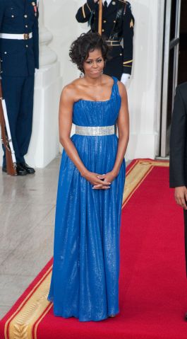 First Lady Michelle Obama waits to greet His Excellency...