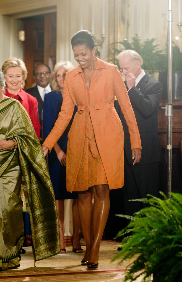 First Lady Michele Obama waits for U.S. President Barack...