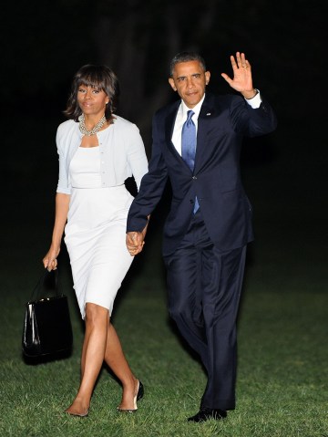 President Obama and first lady Michelle Obama return to the White House