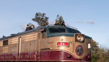 The Napa County wine train offers lunch and wine tasting aboard vintage coaches, and stops for one o