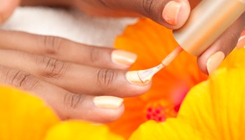 Woman applying nail polish