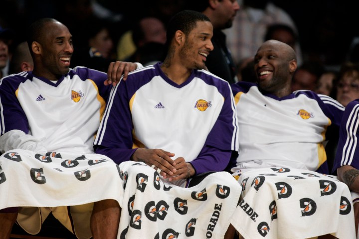 Kobe Bryant (left), Trevor Ariza (middle) and Lamar Odom (right) of the Los Angeles Lakers are jubi