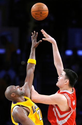 Rockets Yao Ming shoots over Lakers Lamar Odom for a basket in Game 1 in the semifinal of the NBA p