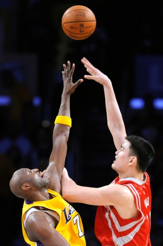 Rockets Yao Ming shoots over Lakers Lamar Odom for a basket in Game 1 in the semifinal of the NBA p