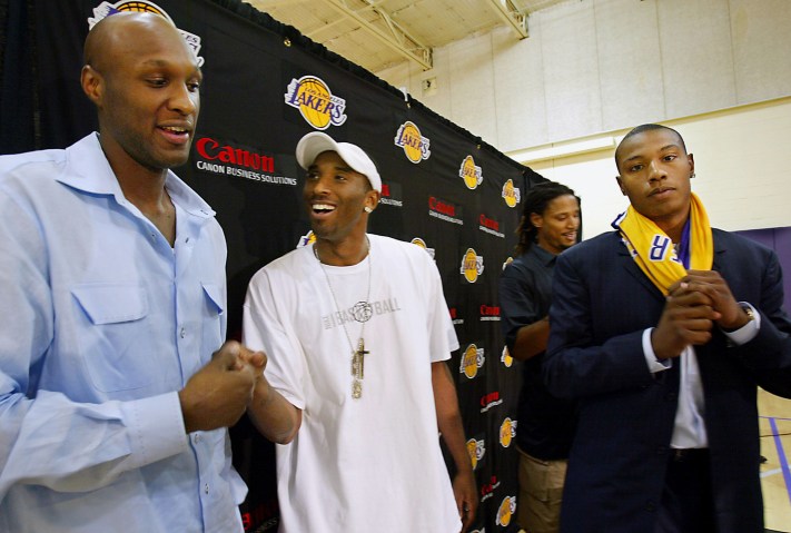Laker Kobe Bryant makes a suprise appearance at a press conference Friday, July 15, 2004 to greet ne