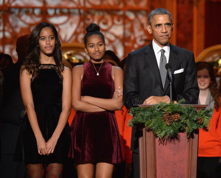 BARACK OBAMA AND HIS DAUGHTERS AT TNT CHRISTMAS IN WASHINGTON, 2014
