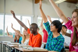 Students Raising Their Hands to Answer Questions