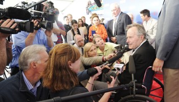 George H.W. Bush is interviewed by reporters while on the red carpet for a special screening of 41,