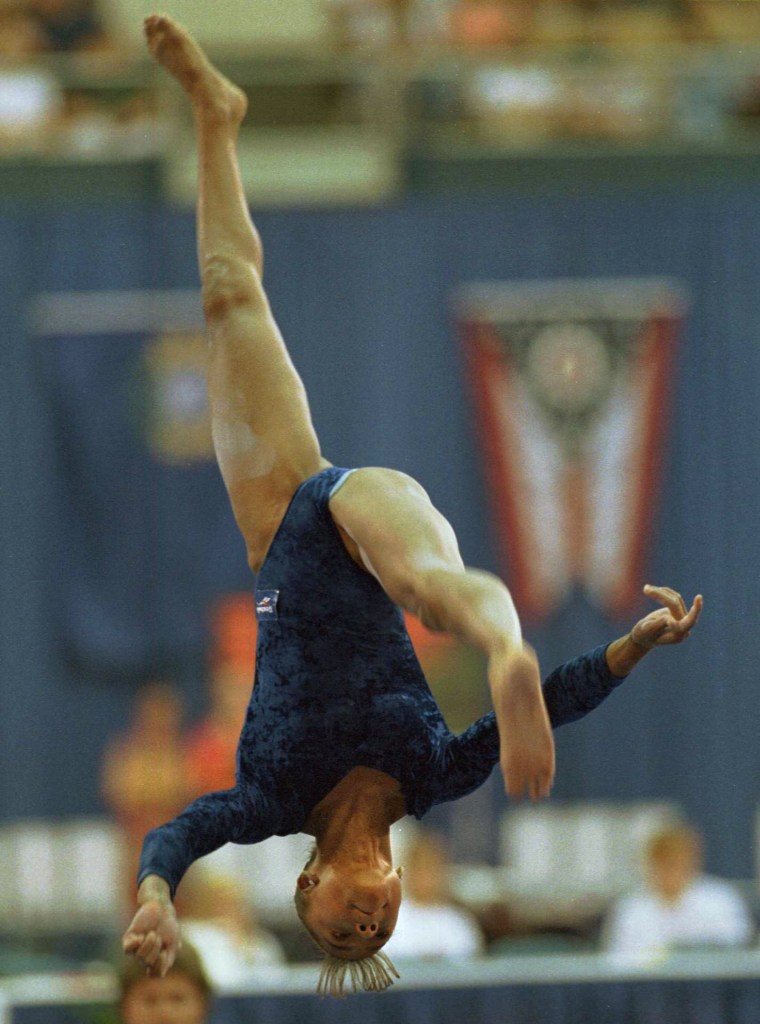 Performing This No Handed Back Walkover On The Balance Beam