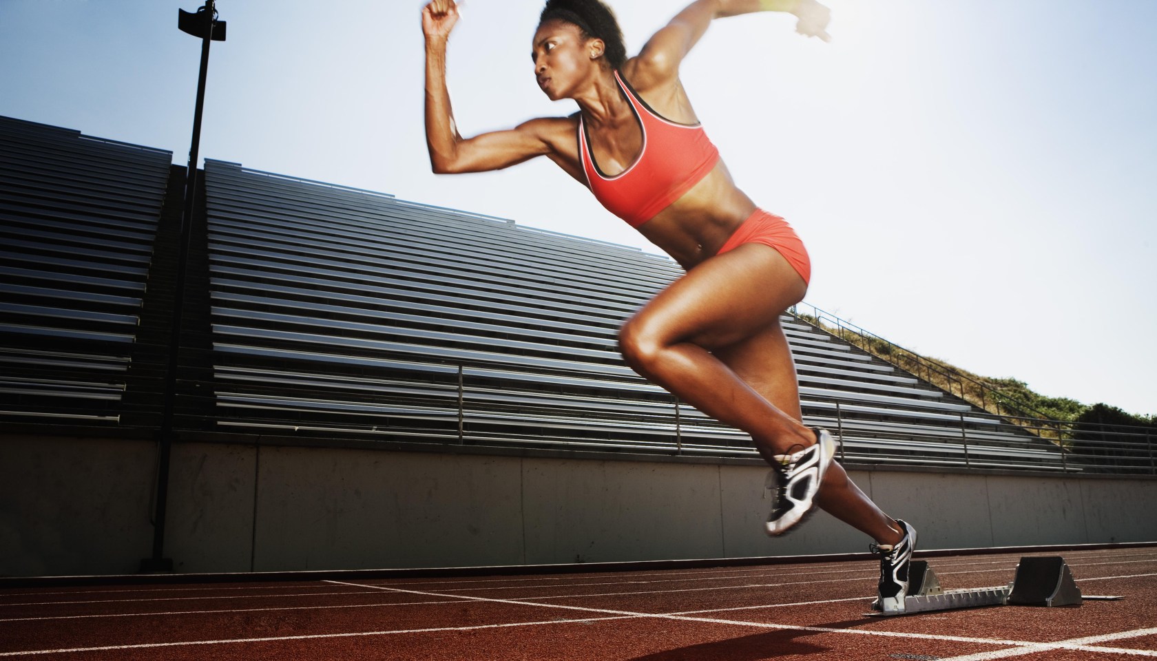 Women running on athletic track