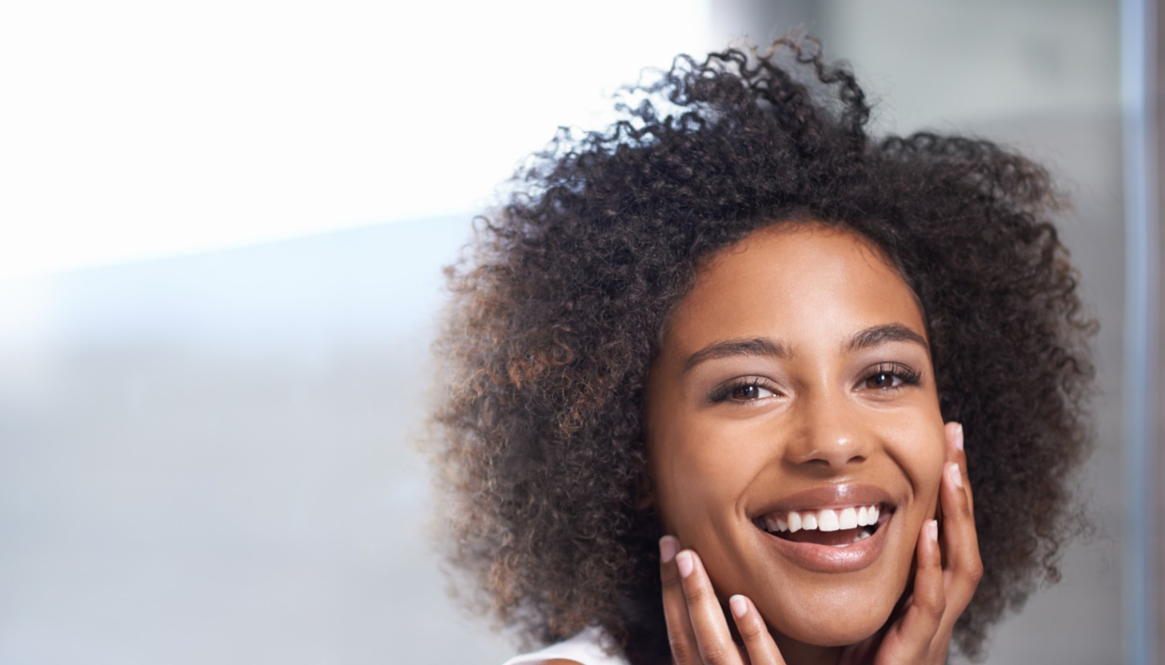 Smooth skin puts a smile on her face