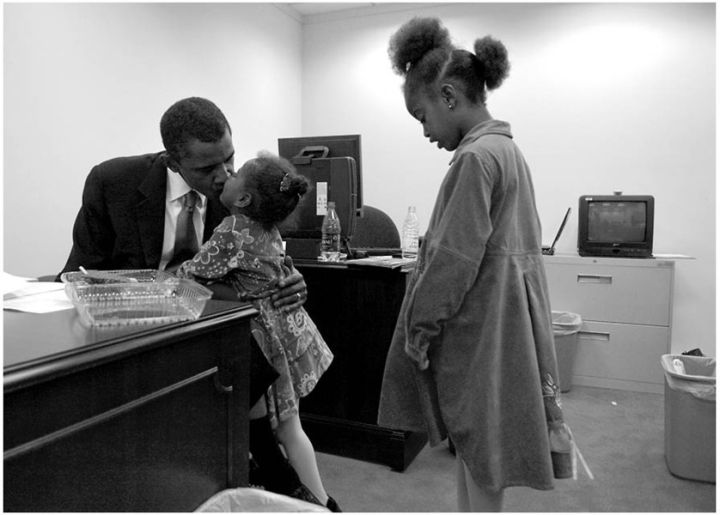 THE OBAMA GIRLS SHARE A WARM EMBRACE WITH THEIR DAD