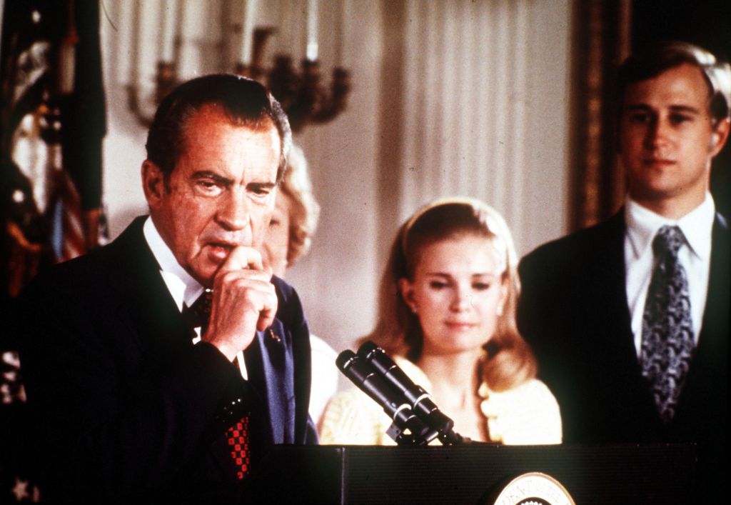 9th AUGUST 1974 Washington D. C. USA. President Richard Nixon of the United States holds back a tear as he makes his resignation speech alongside his family at the White House following the Watergate Scandal.