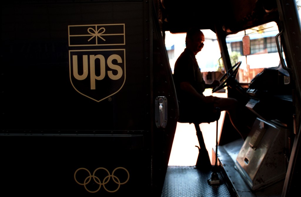 FI.UPS.silhouette.0801.AAGUnited Parcel Service deliveryman Ken Malek starts up his van to continu