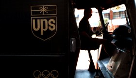 FI.UPS.silhouette.0801.AAGUnited Parcel Service deliveryman Ken Malek starts up his van to continu