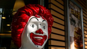 Smile face of a Ronald McDonald statue outside an McDonald's...