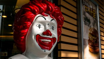 Smile face of a Ronald McDonald statue outside an McDonald's...
