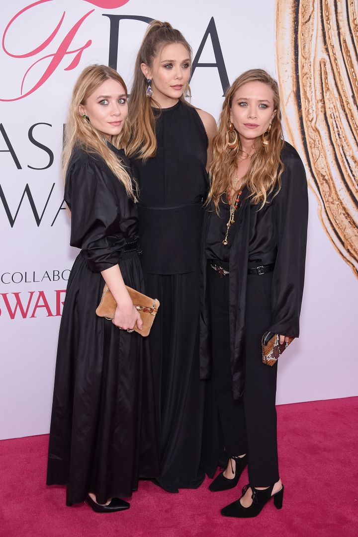 Elizabeth Olsen (center) and Mary-Kate and Ashley Olsen