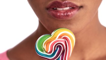 close up of a mouth and lollipop