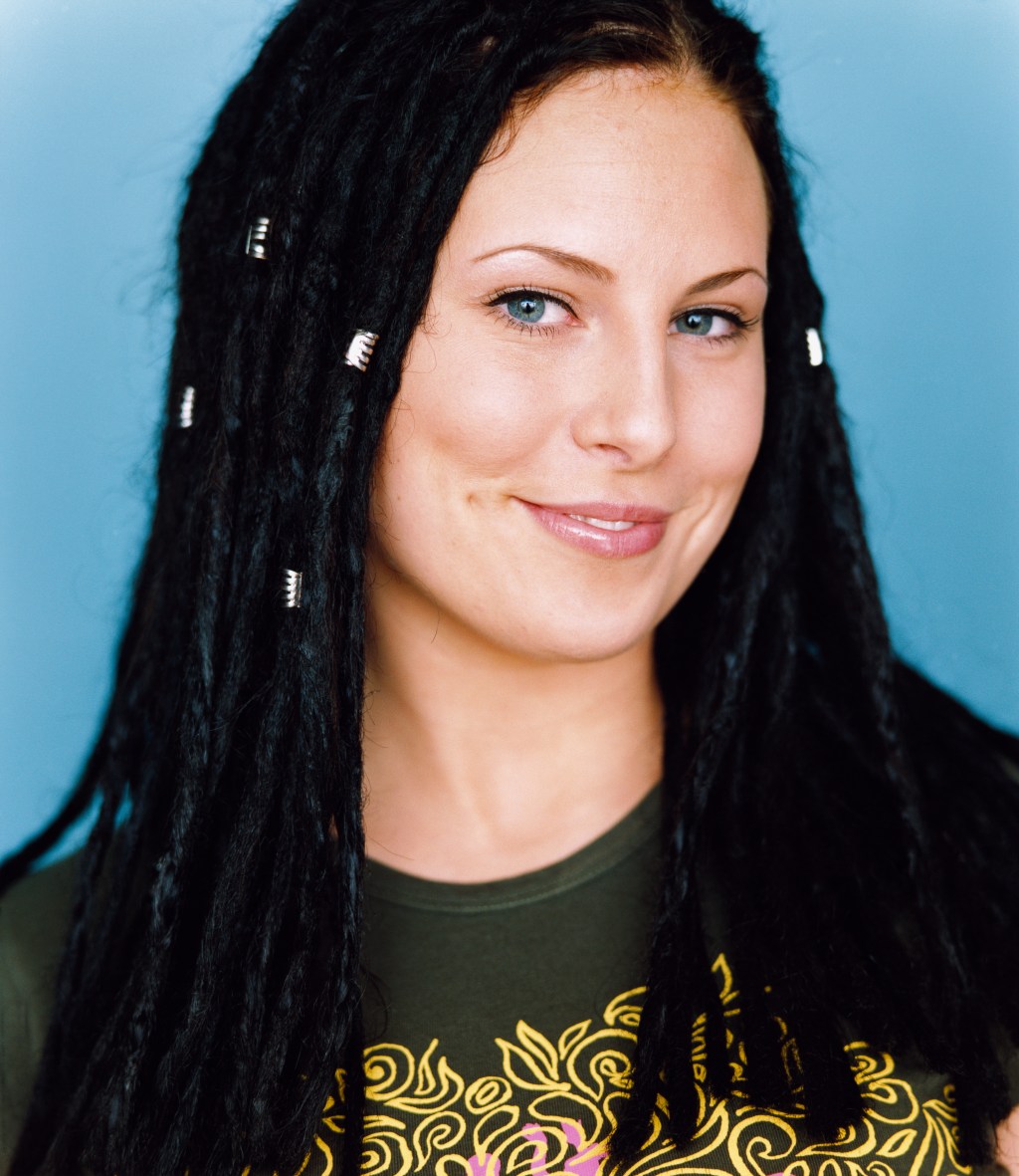 A portrait of a young lady with dreds