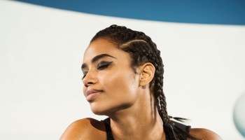 Mixed race woman with braided hair and eyes closed