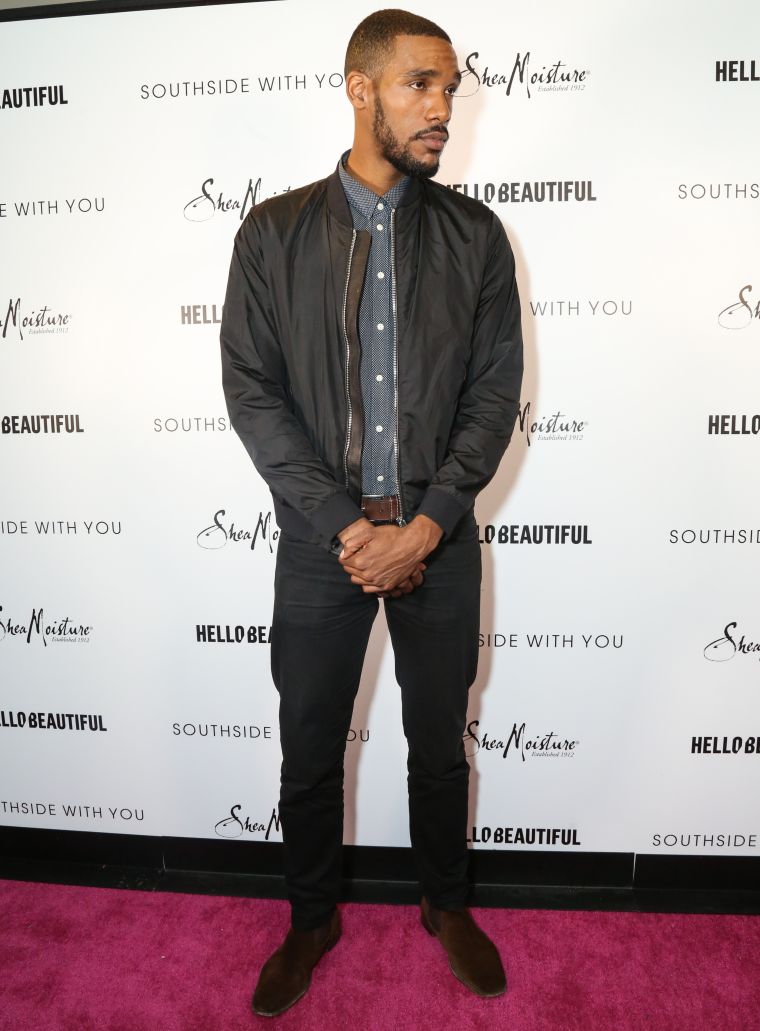 Parker Sawyers poses on the pink carpet at HelloBeautiful’s screening