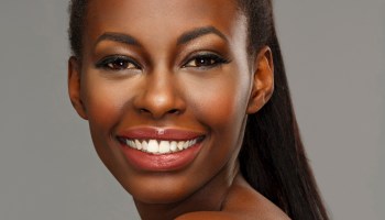 Beauty portrait of beautiful toothy smile young african ethnicity woman