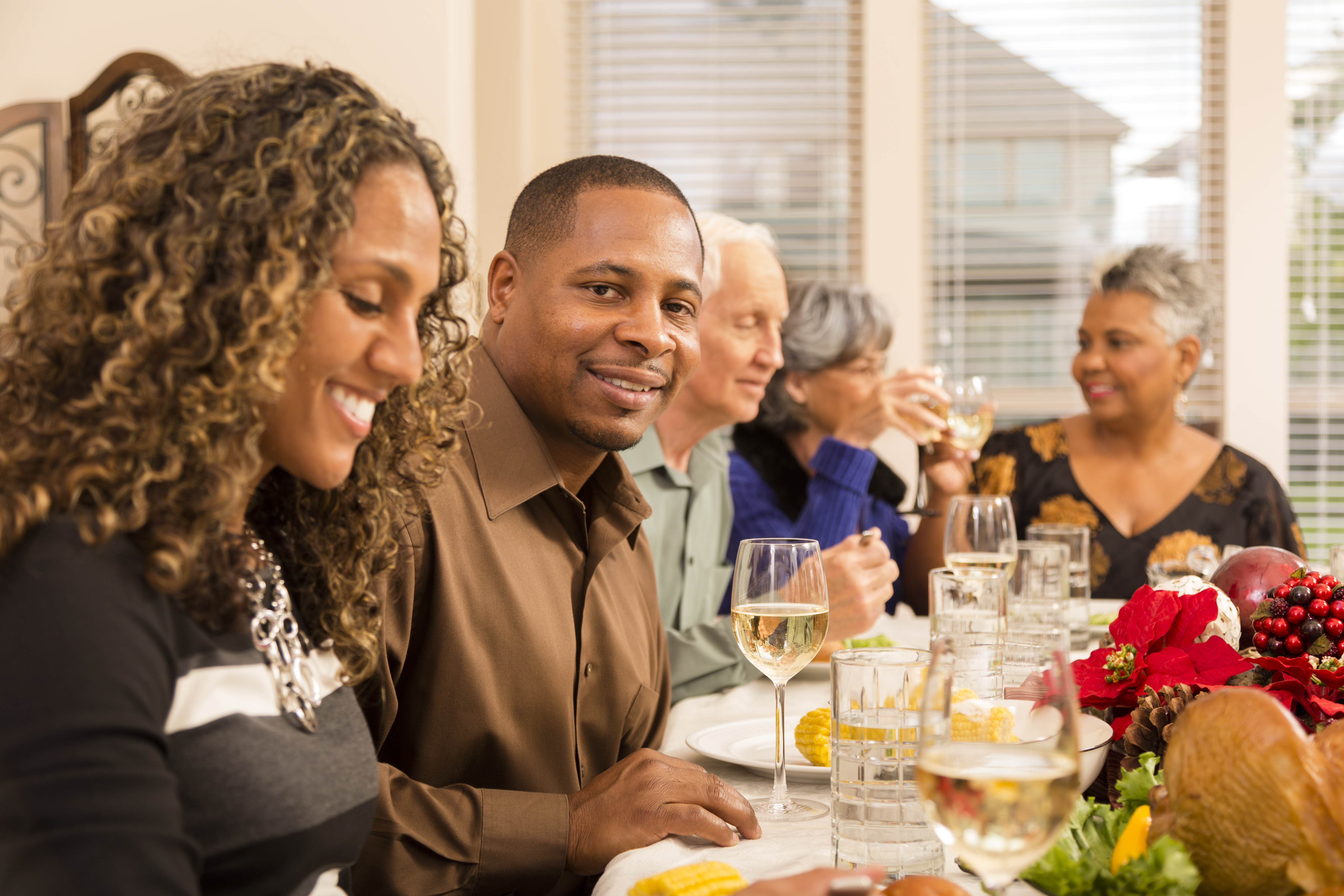 Relationships: Family and friends gather for Christmas dinner party.