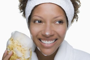 Portrait of attractive woman holding bath sponge