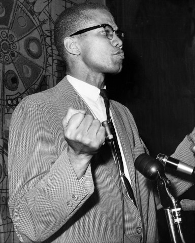 Malcolm X at Park Sheraton Hotel for press conference.